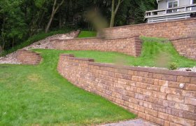 Block retaining wall designed and installed by Exterior Designs of Alexandria