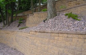 Block retaining wall designed and installed by Exterior Designs of Alexandria