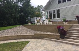 Block retaining wall designed and installed by Exterior Designs of Alexandria